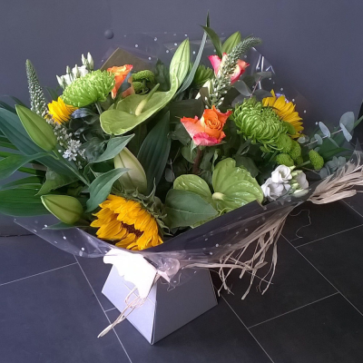 Bright Ideas Flower Bouquet - Beautiful Sunflowers and a peppering of other summer flowers and foliage. Tied in water and presented in a stylish bag. An amazing bouquet full of joy and delight ready to display and enjoy. These flowers will be hand delivered by the local florist.